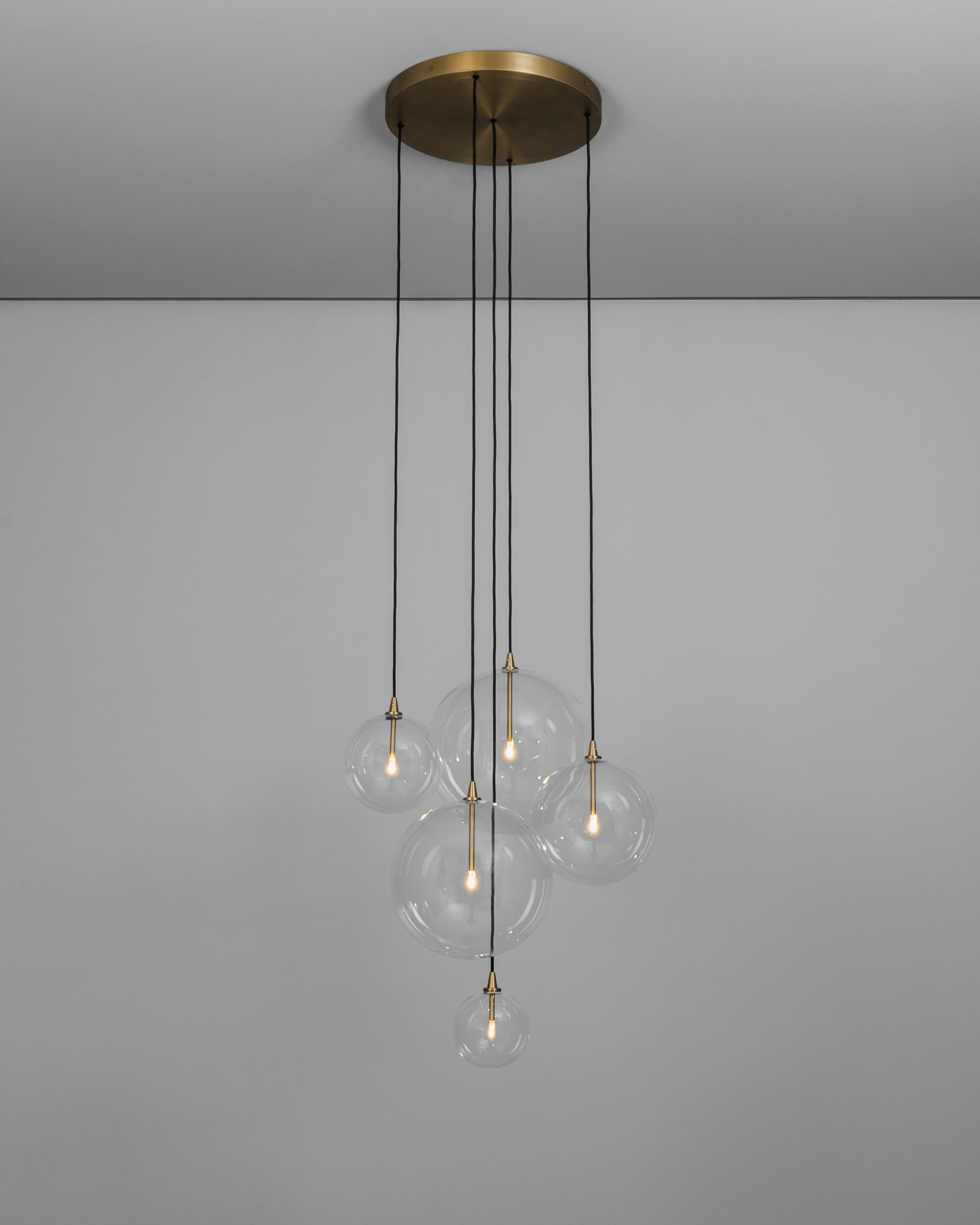 Schwung Cluster 5 Burnished Brass Transparent Globe Mix Chandelier